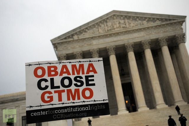 A sign is seen for a demonstration urging the government to close down the detention facility at Guantanamo Bay, outside the U.S. Supreme Court (Astrid Riecken / Getty Images / AFP)