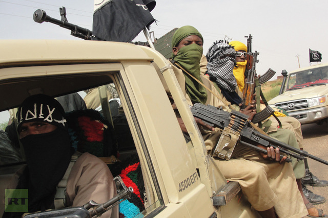 Figthers of the Islamic group Ansar Dine standing guard at Kidal airport, northern Mali (AFP Photo / Romaric Ollo Hien)