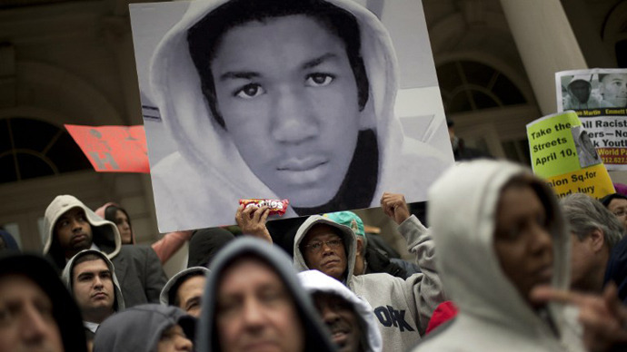 People along with New York City Council members attend a press conference to call for justice in the February 26 killing of 17-year-old Trayvon Martin in Sanford, Florida, on the steps of City Hall March 28, 2012 in New York City. (AFP Photo / Allison Joyce)