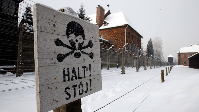 A sign that reads "Stop" placed near a barb wire is seen at the concentration camp during a ceremony marking the 68th anniversary of the liberation of the Auschwitz by Soviet troops and to remember the victims of the Holocaust, in Auschwitz Birkenau.(Reuters / Peter Andrews)