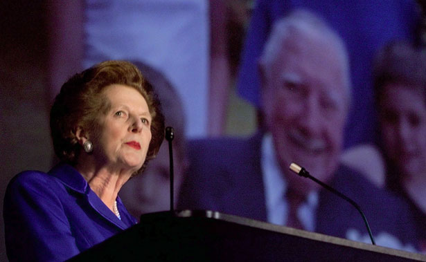 Margaret Thatcher stands in front of an image of Augusto Pinochet at a Conservative Party conference. (Reuters Photo)