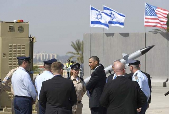 U.S. President Barack Obama chats with military personnel while viewing an Iron Dome missile battery on March 20 at Israel's Ben Gurion International Airport.