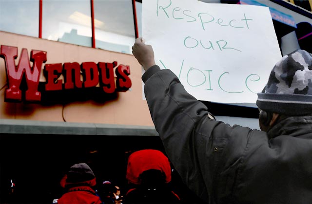 Fast food workers and their supporters demonstrate outside of a Wendy’s restaurant in New York City during a Nov. 29, 2012, walk-out. Labor organizers have staged similar walkouts in six cities thus far. Spencer Platt/Getty Images