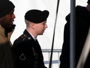 US Army Pfc. Bradley Manning (C) arrives for a hearing in Fort Meade, Maryland.  Photo Credit: AFP