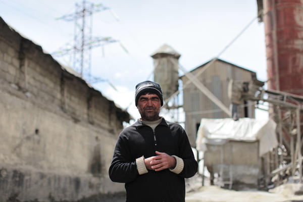 A lone security guard at a closed Tajikistan cement factory. Some 70 percent of Tajiks say they pine for the Soviet Union era. Iason Athanasiadis