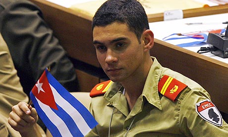 Elian Gonzalez holds a Cuban flag during the Union of Young Communists congress in Havana. Photograph: Ismael Francisco/AP