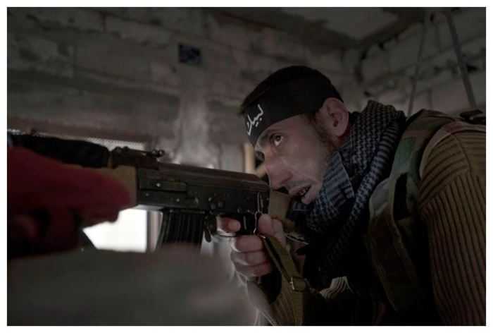A sniper of the Free Syrian Army (AFP Photo / Zac Baillie)