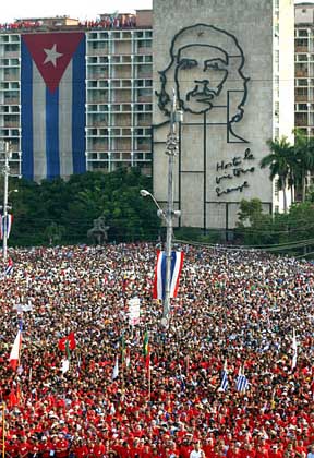 Hundreds of thousands of Cubans participate in the May Day celebration, May 1, 2003 2003 in Havana's Revolution Square, Havana, Cuba At back is a Cuban flag and a sculpture of Che Guevara.  (AP Photo/Jose Goitia)
