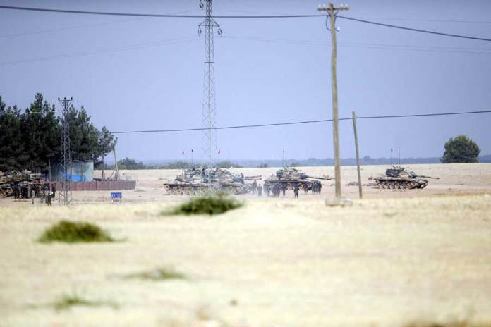 osonun-ilk-icraati-sinirdaki-isid-bayragini-indirmek-oldu_dhapt12